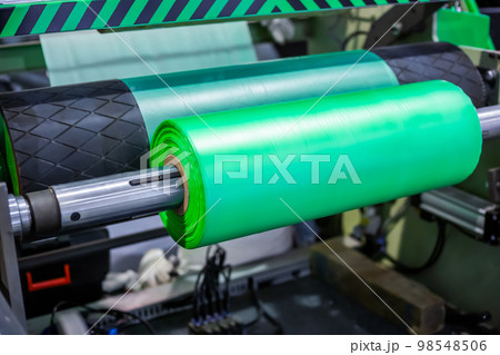 Automatic plastic bag making machine - roller with green polyethylene film Automatic plastic bag making machine - roller with green polyethylene film 98548506