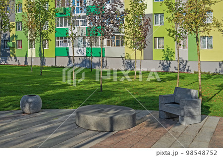 Recreational area in the courtyard of multistorey building 98548752