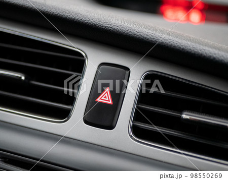Hazard lights button on panel of auto. Concept of hazard, problem, alert, danger, warning, emergency, alarm 98550269