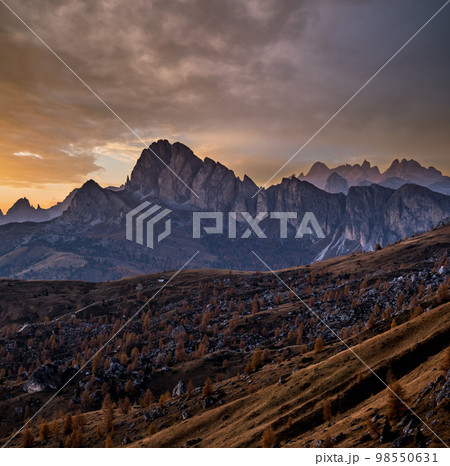 Mountain evening dusk peaceful hazy view from Giau Pass. Mountain evening dusk peaceful hazy view from Giau Pass. 98550631