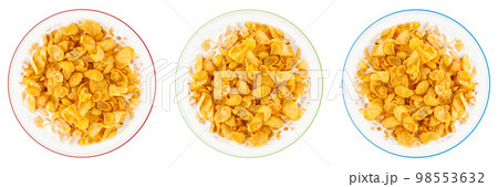 Bowl of sweet cornflakes with milk isolated on white background, top view Bowl of sweet cornflakes with milk isolated on white background, top view 98553632