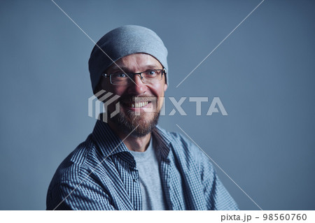 Cheerful man with glasses smiling at camera 98560760