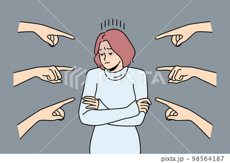 Unhappy woman surrounded with numerous hands pointing  98564187
