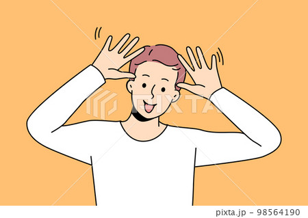 Smiling guy make funny face gesture  98564190