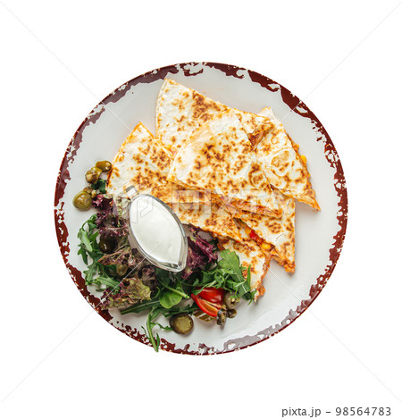 Quesadilla slices with chicken fillet white sauce 98564783