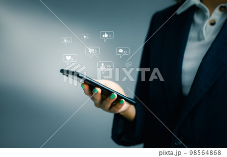 Businesswoman using smartphone in hand with Social media concept.. Businesswoman using smartphone in hand with Social media concept.. 98564868