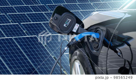 Close up of electric car with a connected charging cable Close up of electric car with a connected charging cable 98565249