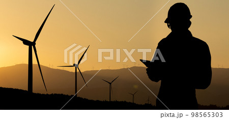 Silhouette of engineer with tablet computer 98565303