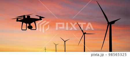 Silhouette of drone and wind turbines 98565325