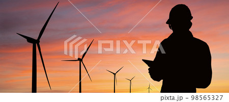 Silhouette of engineer with tablet computer 98565327