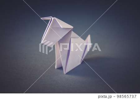 White paper dog origami isolated on a grey background 98565737