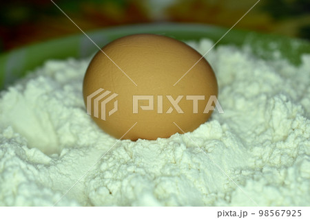 Chicken egg and white wheat flour. Chicken egg and white wheat flour. 98567925