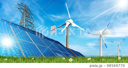 Solar Panels and a Group of Wind Turbines on a Green Meadow 98569770