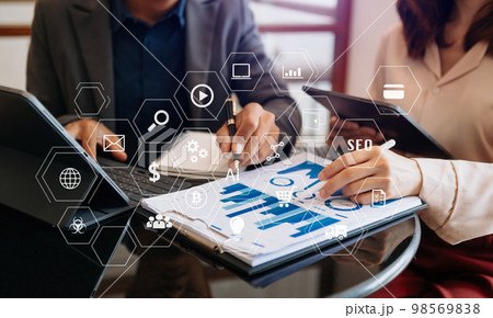Business team present professional investor working new start up project. Digital tablet laptop computer Finance managers meeting with digital marketing media in virtual icon in morning light. Business team present professional investor working new start up project. Digital tablet laptop computer Finance managers meeting with digital marketing media in virtual icon in morning light. 98569838