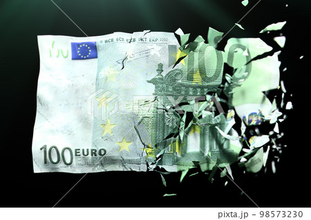 Broken Euro paper money on a green background 98573230