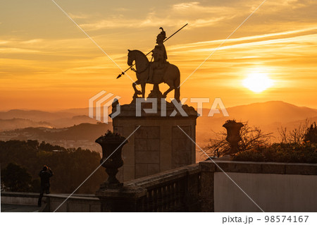 Sunset silhouette of sculpture of St Longinus Sunset silhouette of sculpture of St Longinus 98574167