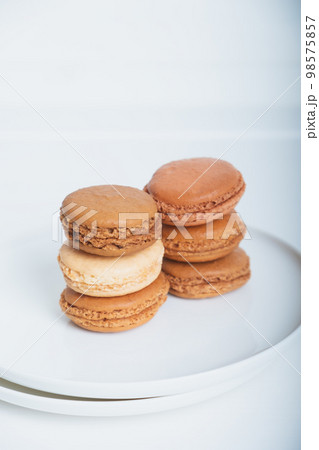 Stack of delicious freshly baked macaron confections. Stack of delicious freshly baked macaron confections. 98575857