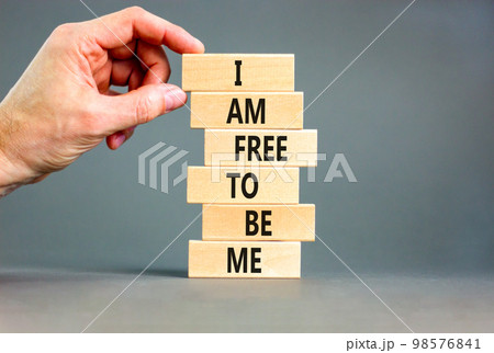 I am free to be me symbol. Concept words I am free to be me on wooden blocks on a beautiful grey table grey background. Businessman hand. Business i am free to be me concept. I am free to be me symbol. Concept words I am free to be me on wooden blocks on a beautiful grey table grey background. Businessman hand. Business i am free to be me concept. 98576841