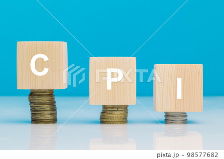 CPI - Customer Price Index word symbol - business concept. Wooden blocks with leters CPI on stacked increasing coin 98577682