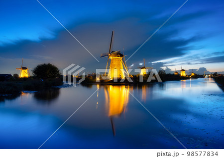Kinderdijk National Park in the Netherlands. Windmills at dusk. UNESCO World Heritage Site. 98577834