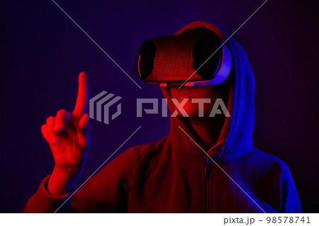person wearing virtual reality glasses gets experience of gaming and entertainment 98578741