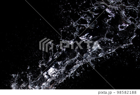 Shape form droplet of Water splashes into drop water attack fluttering in air and stop motion freeze shot. Splash Water for texture graphic resource elements, black background isolated 98582188