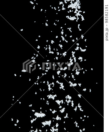 Salt flying explosion, crystal white grain salts explode abstract cloud fly. Beautiful complete seed salt splash in air, food object design. Selective focus freeze shot black background isolated Salt flying explosion, crystal white grain salts explode abstract cloud fly. Beautiful complete seed salt splash in air, food object design. Selective focus freeze shot black background isolated 98582191