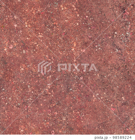 The soil under the feet is red with a textured surface.Texture or background 98589224