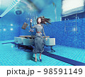underwate living interior in the swiming pool and the woman 98591149