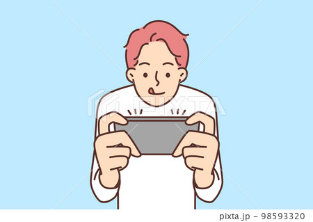 Boy play video game on mobile phone Boy play video game on mobile phone 98593320