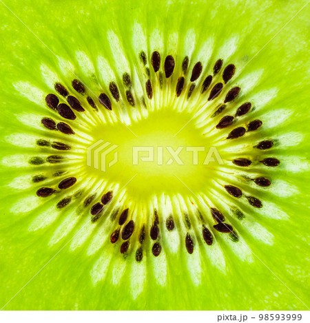 Fresh kiwi fruit slices closeup macro texture background Fresh kiwi fruit slices closeup macro texture background 98593999