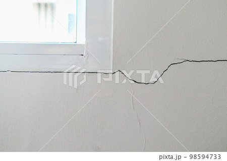 New house wall crack near window frame New house wall crack near window frame 98594733