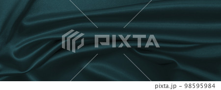 Smooth elegant blue silk or satin luxury cloth texture as abstract background. Luxurious Christmas background or New Year background design 98595984