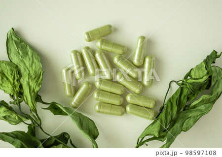 Herbal medicine capsules with Andrographis paniculata leaf on white background Herbal medicine capsules with Andrographis paniculata leaf on white background 98597108