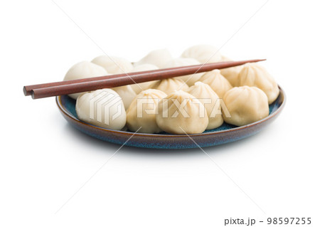 Xiaolongbao, traditional steamed dumplings on plate. Xiao Long Bao buns isolated on white background. 98597255