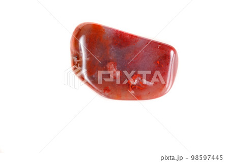 Macro mineral stone Carnelian on white background 98597445