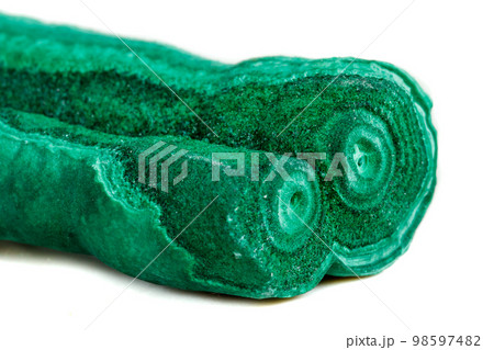 Macro mineral stone malachite stalactite on white background 98597482