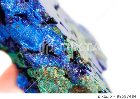 Macro mineral stone malachite with azurite on white background 98597484