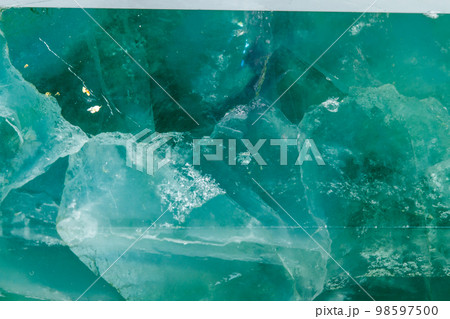 Macro mineral stone Fluorite crystal on a black background 98597500