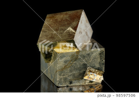 Macro mineral stone Pyrite on a black background 98597506
