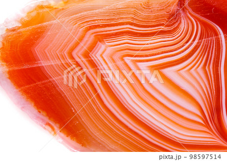 Macro mineral orange agate in crystals on white background Macro mineral orange agate in crystals on white background 98597514