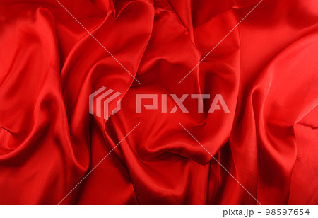 Red silk fabric background closeup Red silk fabric background closeup 98597654