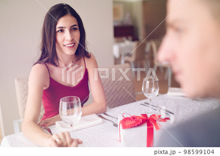 Valentine's Day concept. Happy couple in love. Couple celebrating Valentine's Day in restaurant. Valentine's Day concept. Happy couple in love. Couple celebrating Valentine's Day in restaurant. 98599104