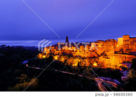 Old historical medieval town of Pitigliano in Tuscany at sunset, Italy 98600360