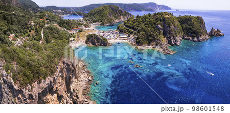 Corfu island. aerial drone view of  most popular and beautiful Paleokastrtsa tourist village and resort, Ampelaki Beach. Greece, ionian islands 98601548