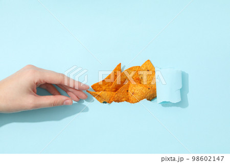 Concept of tasty snacks, tasty corn chips Concept of tasty snacks, tasty corn chips 98602147