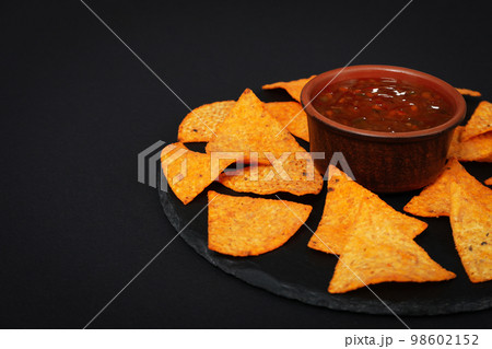 Concept of tasty snacks, corn chips, space for text Concept of tasty snacks, corn chips, space for text 98602152