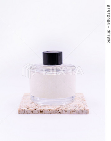 Wooden aroma sticks in a glass flask filled with flavor liquid substance isolated over white background, side view  98602639