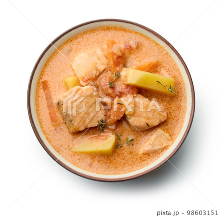 bowl of salmon and tomato soup 98603151