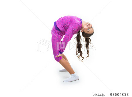 cheerful flexible teen girl stretching in studio. flexible teen girl stretching on background. cheerful flexible teen girl stretching in studio. flexible teen girl stretching on background. 98604358